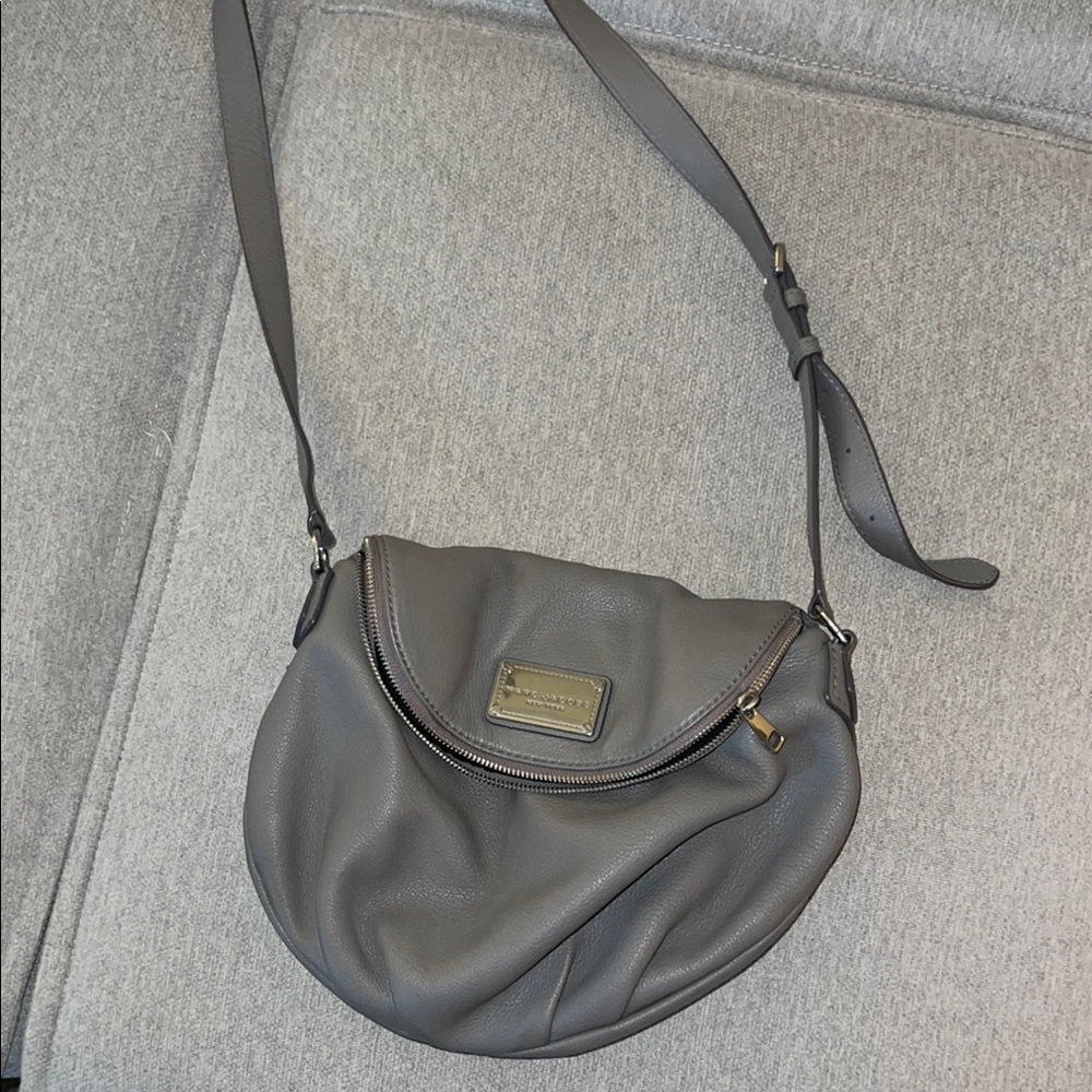 Marc Jacob’s Gray Crossbody Bag with Adjustable Strap and Flap Closure